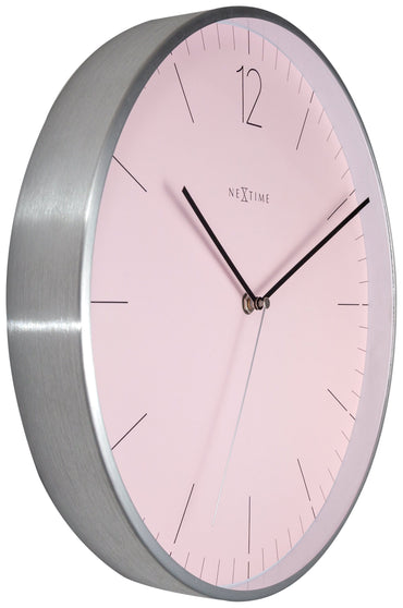 Elegant NeXtime Essential Silver wall clock with a 34 cm glass and metal design, shown from the left side.