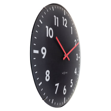 Large NeXtime Duomo 50cm wall clock with domed glass lens, silent mechanism, and modern design, viewed from the left side.