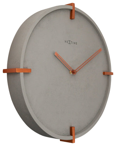 NeXtime Clocks Mohawk Wall clock, 32 cm concrete finish, round design with minimalist black hands on a light gray concrete surface.