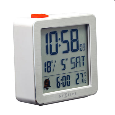Mini digital table alarm clock by NeXtime Clocks, featuring a compact metal and ABS design, viewed from the left side.