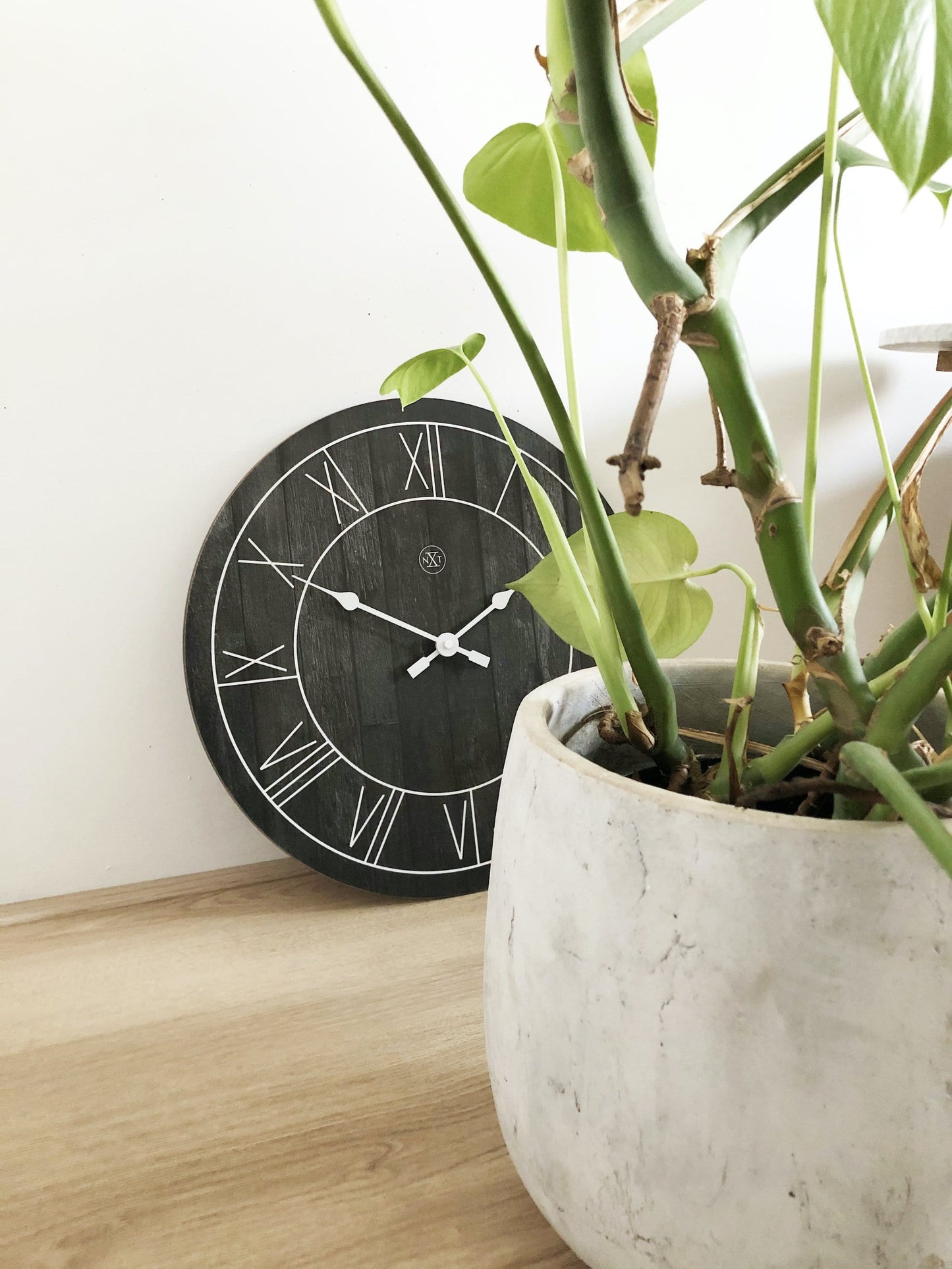 Wood wall clock by NeXtime Clocks, 40 cm diameter, with a natural finish and minimalist design named 'Paul'.