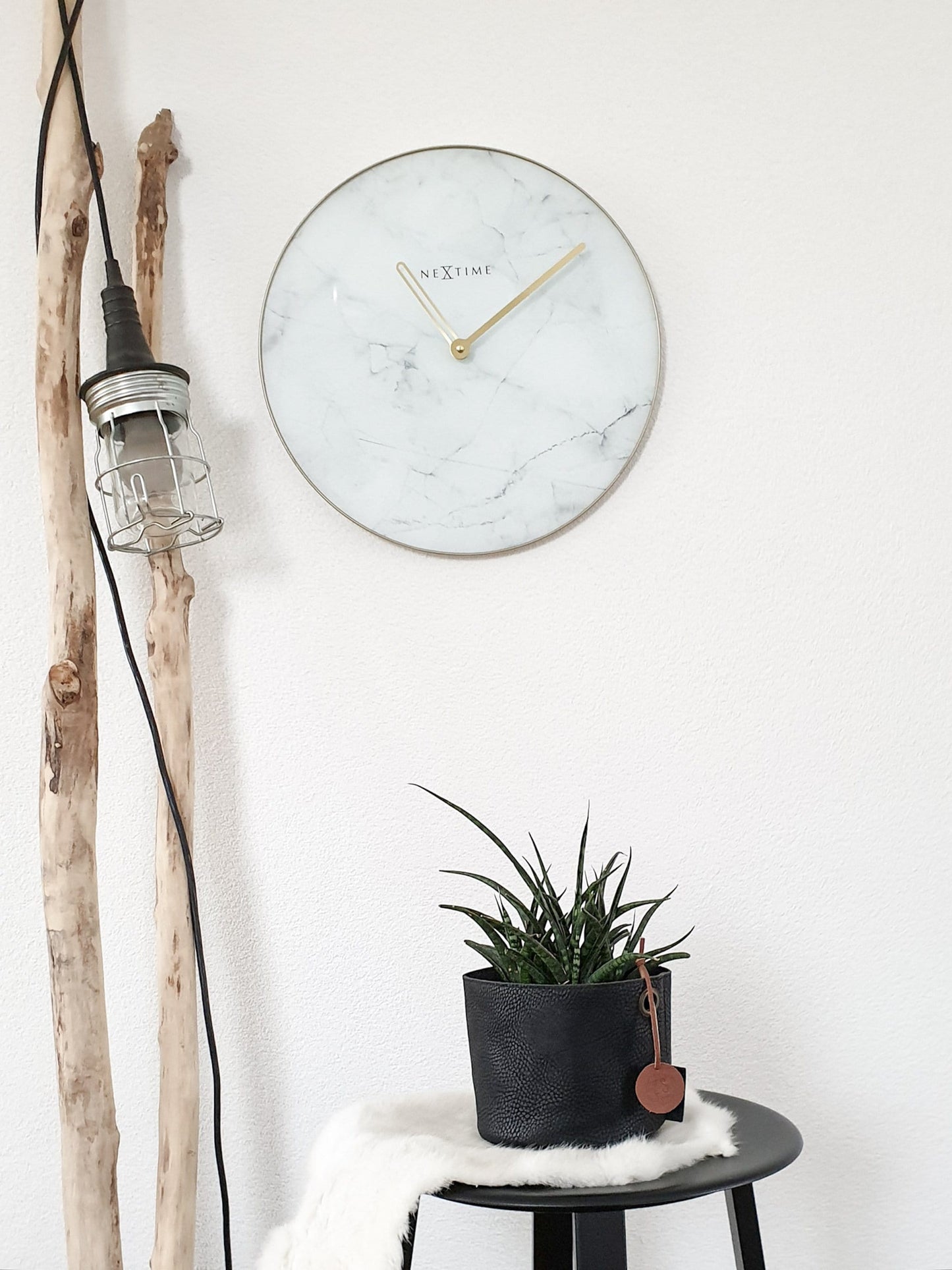 NeXtime Clocks 40cm wall clock with marble-patterned glass and metal frame, modern design for home decor.