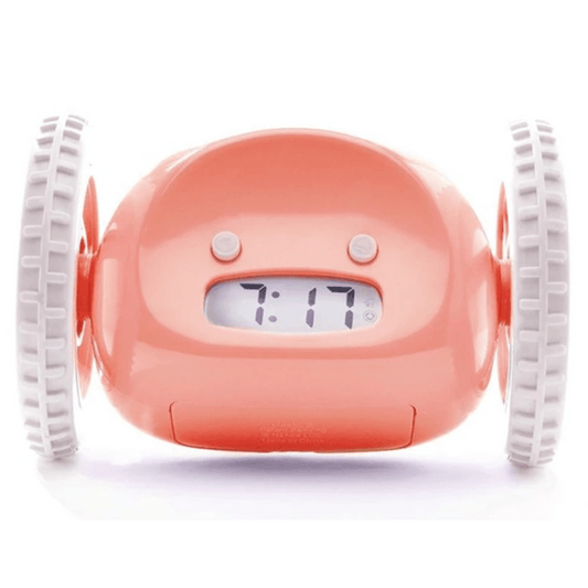 Pink NeXtime Clocks Clocky alarm clock on wheels with digital display and snooze button, designed to wake you up with movement.
