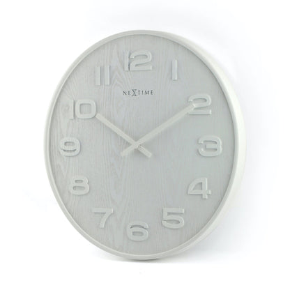 Wood Wood Medium wall clock by NeXtime Clocks, 35 cm diameter, wooden face with black clock hands, mounted on a wall.