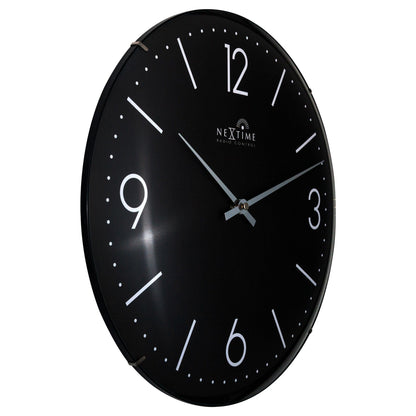 NeXtime Atomic wall clock with 35cm dome glass, radio-controlled DCF timekeeping, and sleek design, shown from the left side.