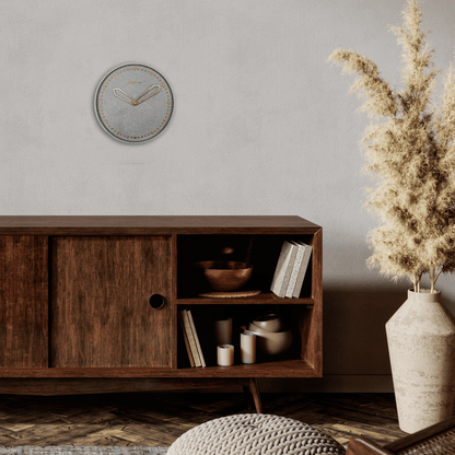 NeXtime Clocks wall clock with a 35cm cross-shaped design made of polyresin, featuring a detailed and artistic display.