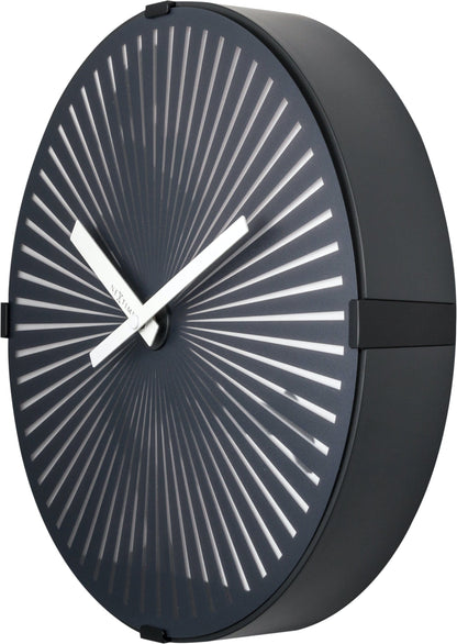 NeXtime Clocks wall clock with a 30cm plastic case featuring a running man motion design, right side view.