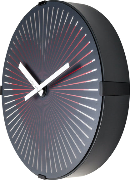 Red NeXtime Motion Heart wall clock, 30 cm plastic clock with moving heart design, shown from the right side.