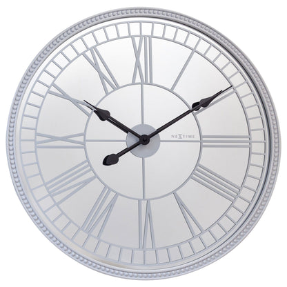 Large 56cm NeXtime Clocks wall clock with mirror finish, silent mechanism, glass face, titled "Cleopatra's Mirror" design.