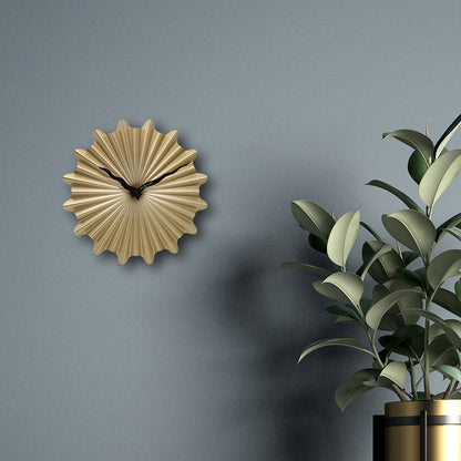 NeXtime Clocks 40cm silent metal wall clock with "Sunny" design, showcasing a modern, minimalist style and a sleek metal finish.
