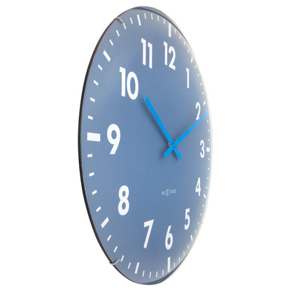 Large NeXtime Duomo 50cm wall clock with domed glass lens, silent operation, and black finish, shown from left side.