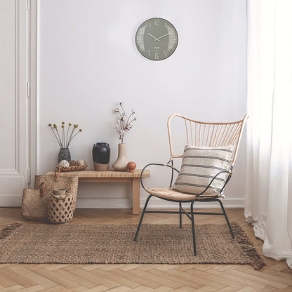 NeXtime Clocks wall clock with 35cm domed glass lens, silent mechanism, and modern design in a stylish interior setting.