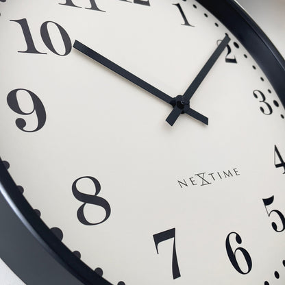 NeXtime Dickens wall clock, 30cm silent plastic clock with black and white face, vintage-inspired design.