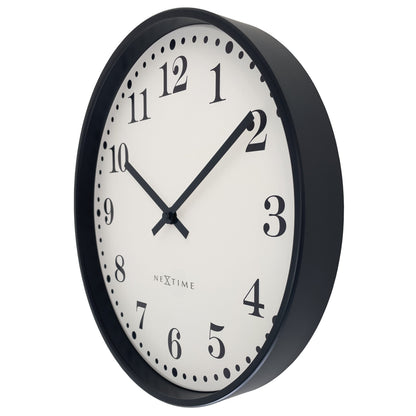 NeXtime Dickens wall clock, 30cm diameter, black and white plastic design, silent mechanism, shown from the right side.
