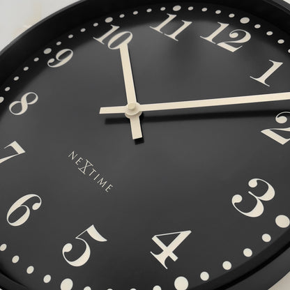 NeXtime Dickens 30cm black and white wall clock with silent mechanism, plastic frame, detailed close-up view.