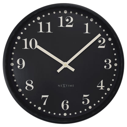 NeXtime Dickens wall clock, 30cm black and white plastic clock with silent movement, front view showing clock face and hands.