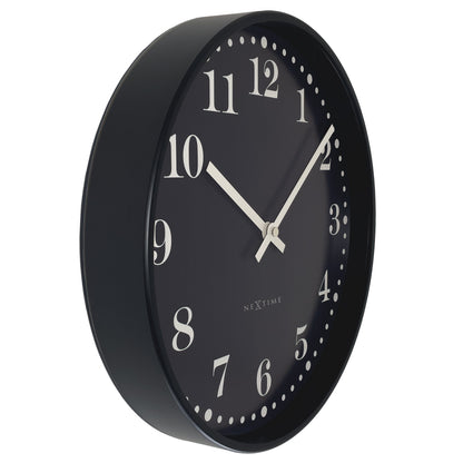 Black and white NeXtime Dickens wall clock, 30cm diameter, silent plastic design with classic style, shown from the left side.