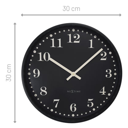 NeXtime Dickens wall clock, 30cm black and white plastic clock with silent movement, featuring classic Dickens-inspired design.