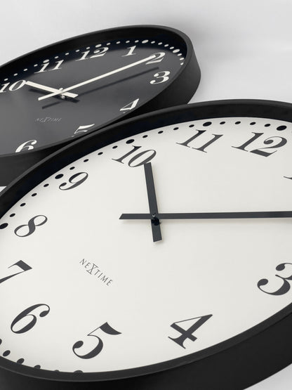 Large 50cm black and white NeXtime Dickens wall clock with silent quartz movement, plastic frame, and clear easy-to-read numerals.