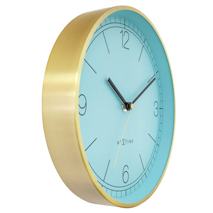 NeXtime Bolero wandklok van 25cm met turquoise, wit en zwart, metalen ontwerp, stille werking, zijaanzicht.