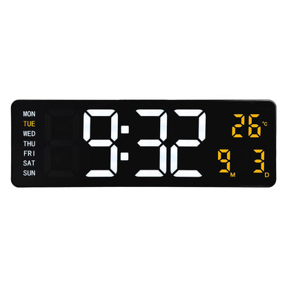 NeXtime Super Digi digital wall alarm clock in black with large LED display, measuring 38.8x12.9x3.2cm, made of black ABS plastic.