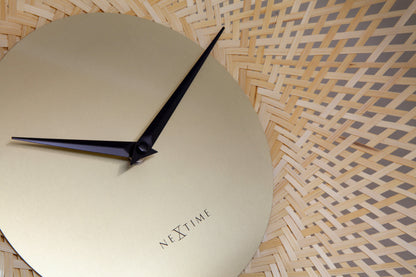 Detailed view of NeXtime Vortex wall clock, 60cm silent clock with brown and black bamboo design.