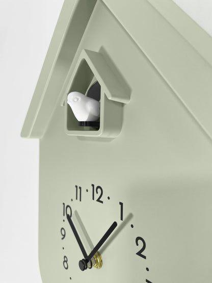 NeXtime Twitter wall clock with pendulum, cuckoo feature, measuring 21.5x41.5x8.5cm, detailed view showing clock face and design