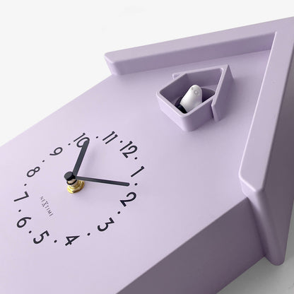 NeXtime Twitter wall clock with pendulum, cuckoo feature, measuring 21.5x41.5x8.5cm, detailed view of clock face and design.