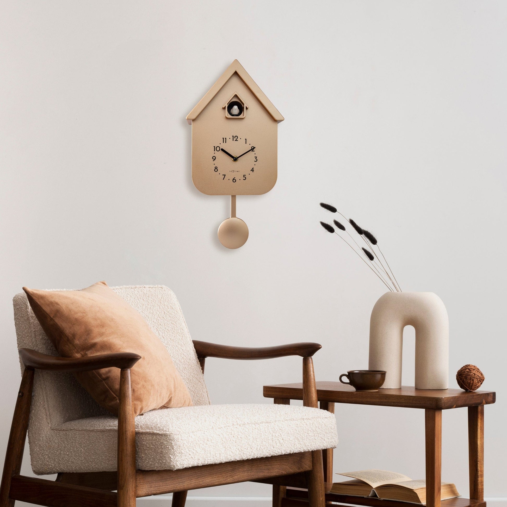 NeXtime Wall Clock with pendulum and cuckoo design, measuring 21.5x41.5x8.5cm, featuring Twitter-themed face and decorative elements.