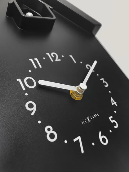NeXtime Twitter wall clock with pendulum, cuckoo feature, measuring 21.5x41.5x8.5cm, detailed close-up showing clock face and design