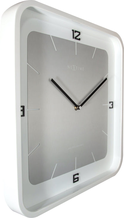 Square NeXtime wall clock, 40x40 cm, wooden frame, showing a modern design with black clock hands and minimalist style.