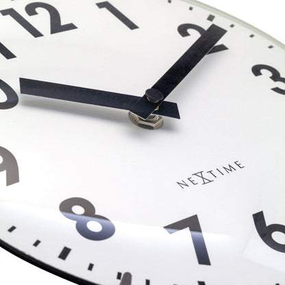 NeXtime Duomo Mini wall or table clock with 20cm diameter, domed glass lens, silent movement, and minimalist design.
