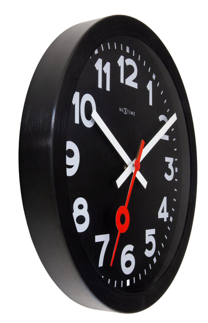 Black NeXtime Station wall clock, 35cm silent aluminum design with modern all-black finish, shown from the left side.