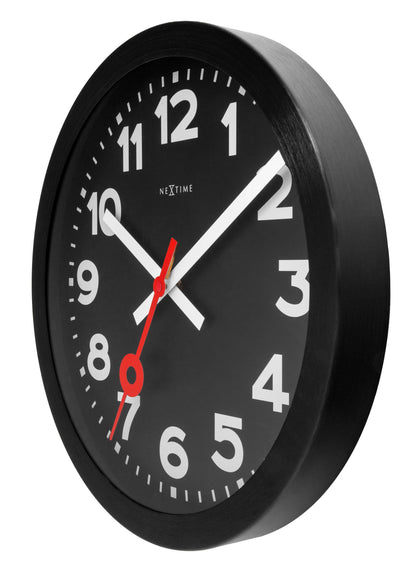 Black anodized aluminium wall clock by NeXtime, 35cm silent station design, shown from the right side.