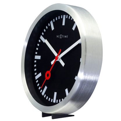 Black aluminum Station Stripe wall or table clock by NeXtime Clocks, showing the clock face with bold stripes and modern design.