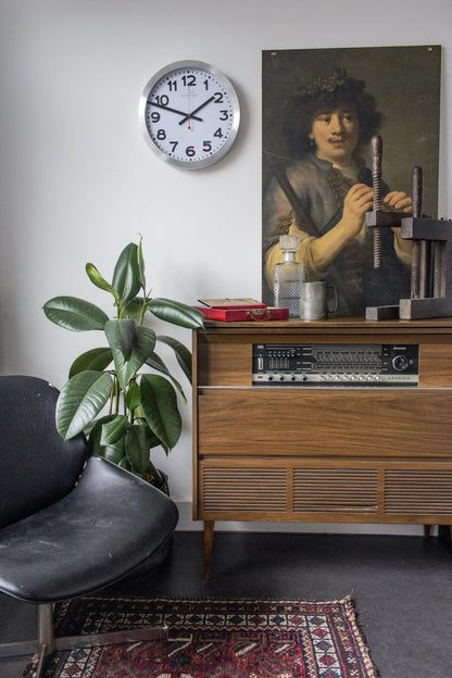 NeXtime Clocks wall clock with a 35cm aluminum face featuring station radio-controlled (DCF) numbers.