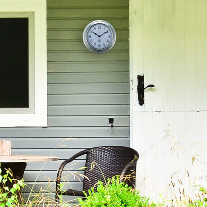 Weatherproof outdoor garden wall clock by NeXtime, 22cm metal galvanized Poppy design, suitable for outdoor use.