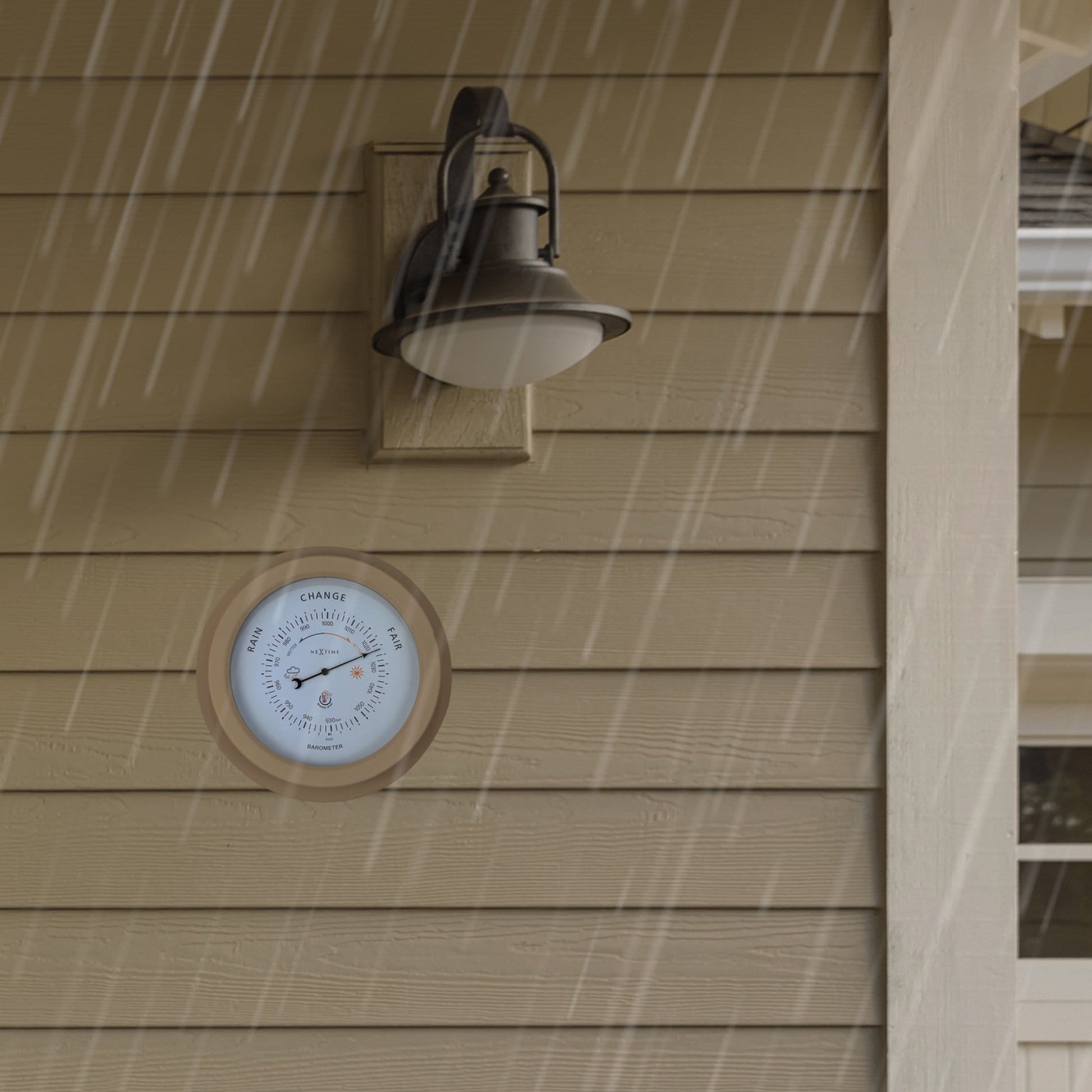 Weatherproof garden barometer by NeXtime Clocks, 22cm galvanized metal with orchid design, measuring atmospheric pressure outdoors.