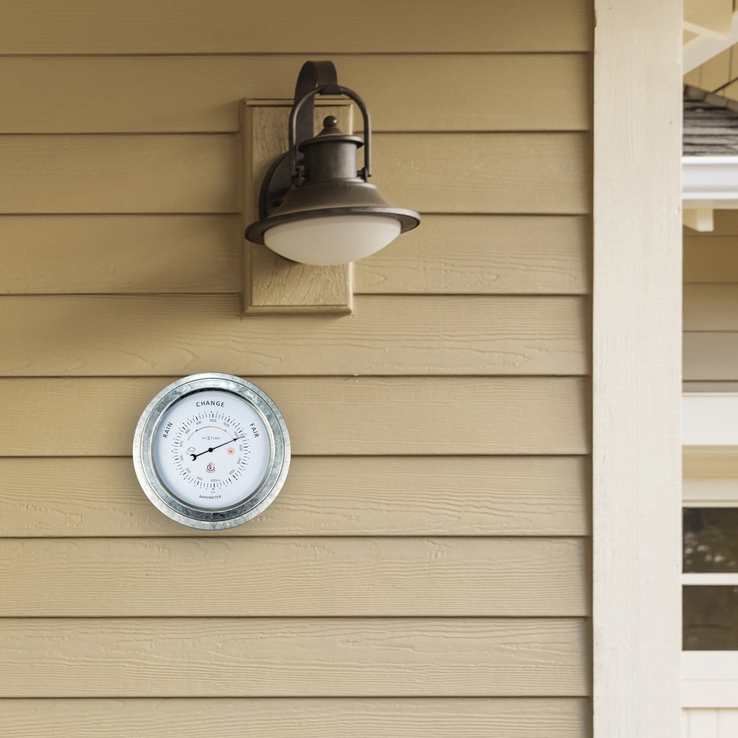Weatherproof garden barometer by NeXtime Clocks, 22cm galvanized metal with orchid design, showing atmospheric pressure indicators.