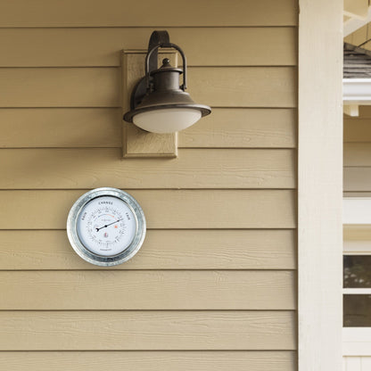 Weatherproof garden barometer by NeXtime Clocks, 22cm galvanized metal with orchid design, showing atmospheric pressure indicators.