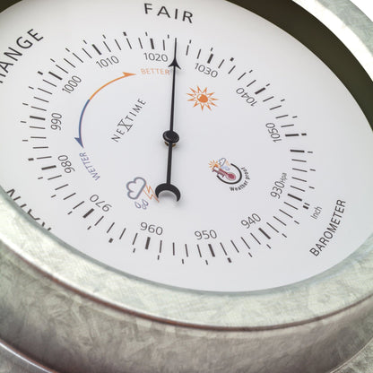 Weatherproof NeXtime Clocks garden barometer with 22cm galvanized metal orchid design for outdoor weather monitoring.