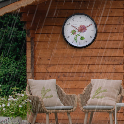Weatherproof outdoor garden clock by NeXtime Clocks, 30.5 cm diameter, featuring a stylish Knautia design.