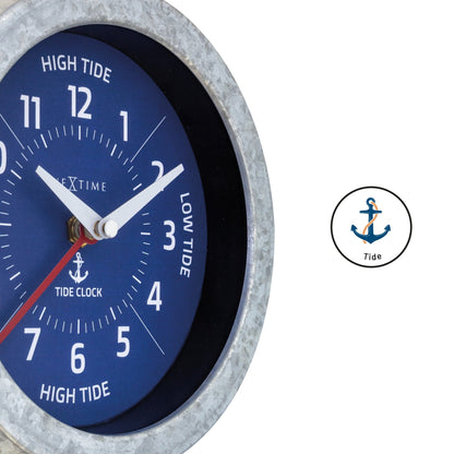 NeXtime Tide wall clock with galvanized silver finish, 22cm diameter, displaying tide status and time, detailed close-up image.