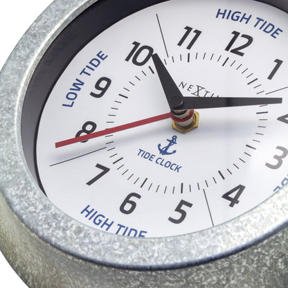 NeXtime Tide wall clock with galvanized silver finish, 22cm diameter, showing tide status with detailed hour and minute hands.