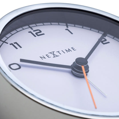 NeXtime Clocks metal alarm clock, 9x9x7.5 cm, with classic design and "Company Alarm" label, detailed view of the clock face and body.
