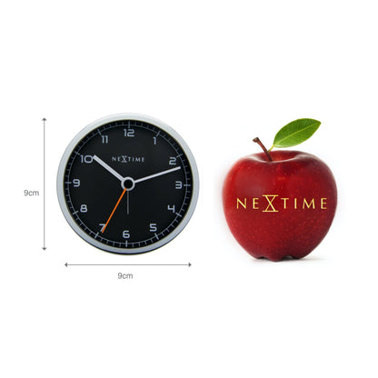 NeXtime Clocks metal alarm clock, 9x9x7.5 cm, with classic design and analog dial, labeled 'Company Alarm'.
