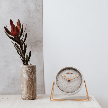 NeXtime Clocks table clock in polyresin, 17.5 x 15.5 x 5 cm, with a modern design and textured surface.