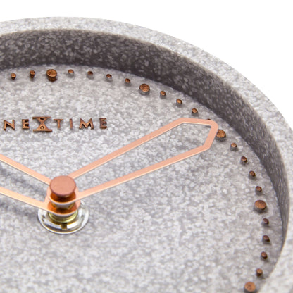 NeXtime Clocks table clock made of polyresin, measuring 17.5 x 15.5 x 5 cm, with a detailed decorative design.