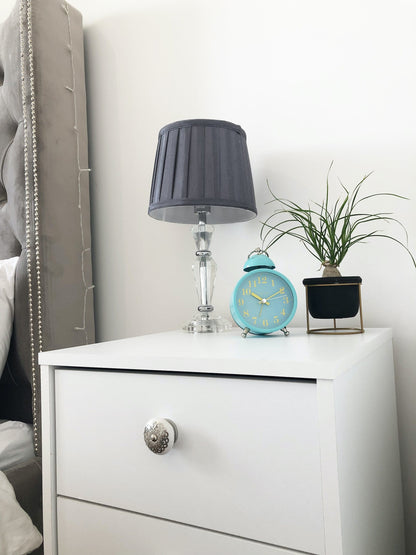 NeXtime Clocks metal alarm clock with a 16cm diameter and loud single bell sound, ideal for bedside use.