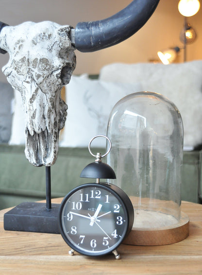 NeXtime Clocks metal alarm clock with 16 cm diameter, loud single bell alarm, black finish, and vintage design.